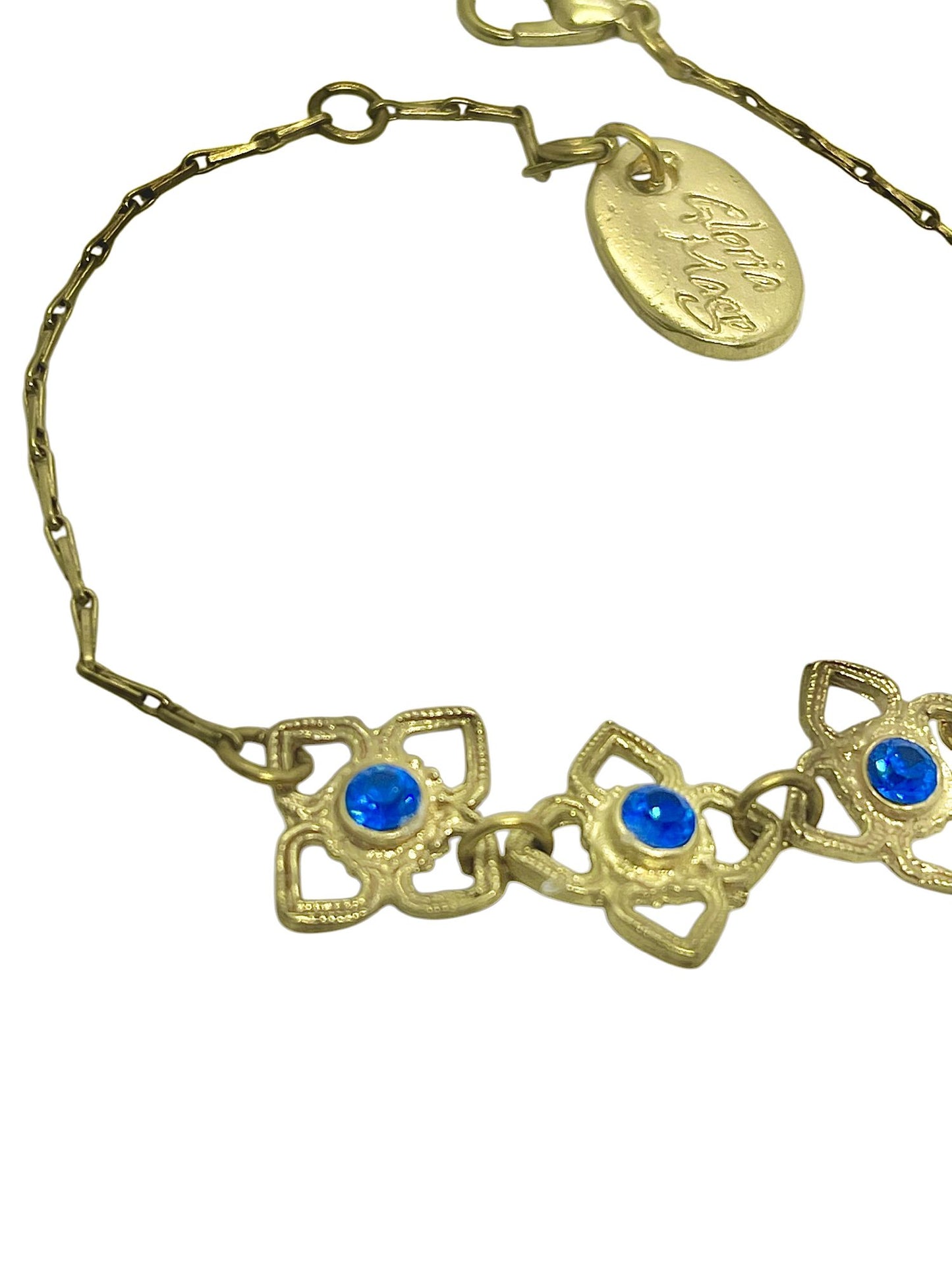 Pulsera Mismy dorado Tres flores y cristal SW color azul