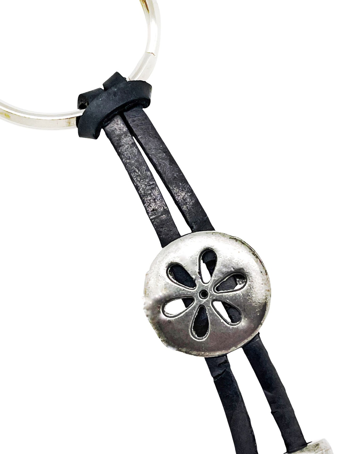 Llavero Happy en negro y plata chapado