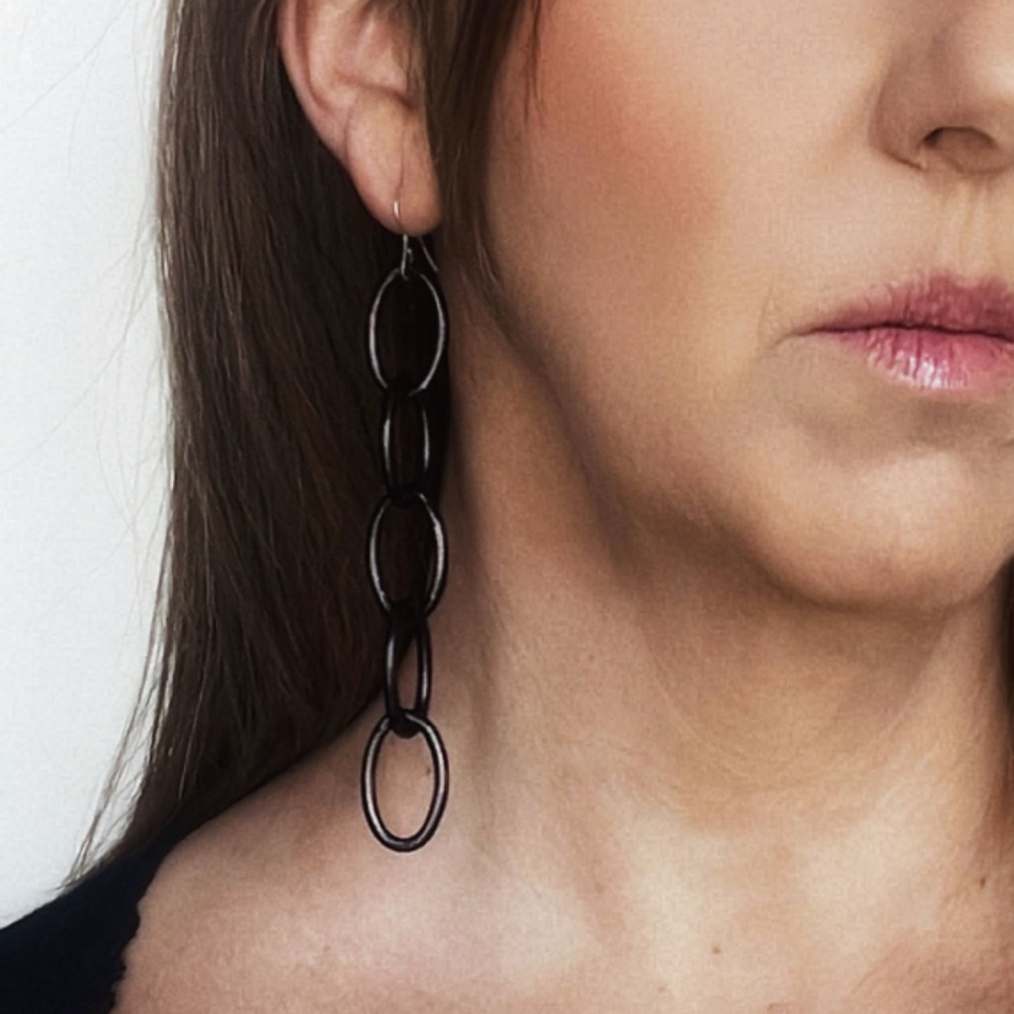 Brinco de corrente preta