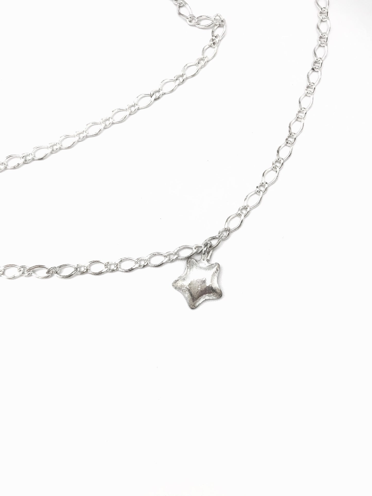 Cinturón cadena plata con colgantes de estrella