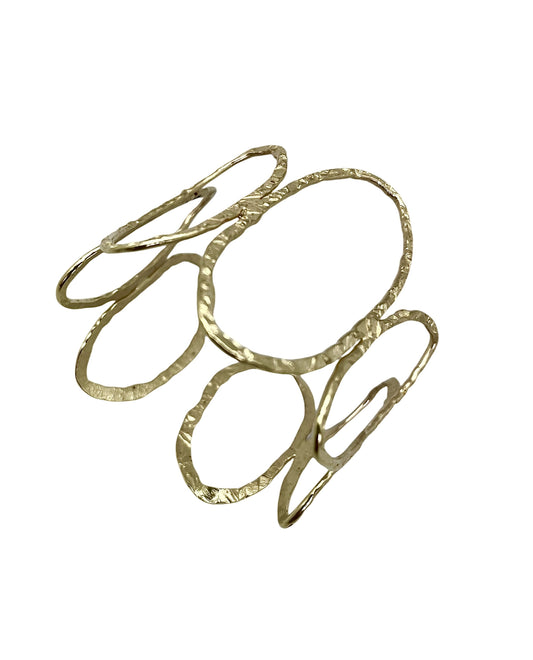 Brazalete Orion en laton dorado ajustable
